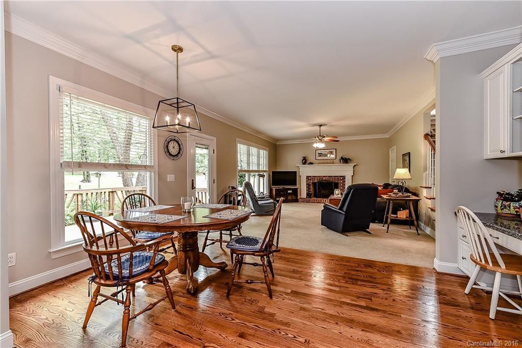 325 Kimberly Road Davidson, NC 28036 - Photo 9 of 22 a view of a dining room with furniture window and wooden floor