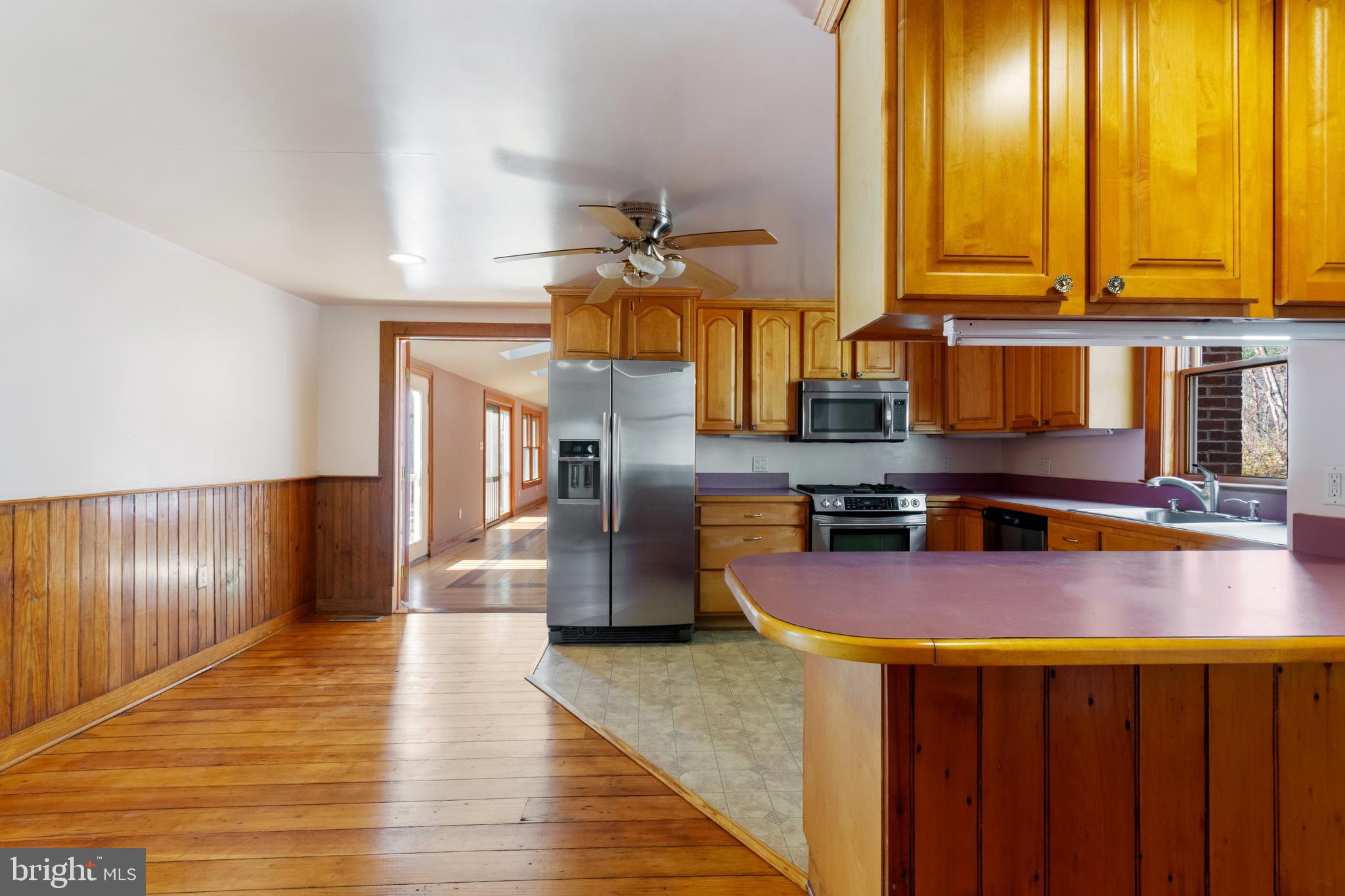 4100 Simpson Drive Westminster, MD 21158 - Photo 11 of 52 a kitchen with stainless steel appliances granite countertop a refrigerator a sink and a stove