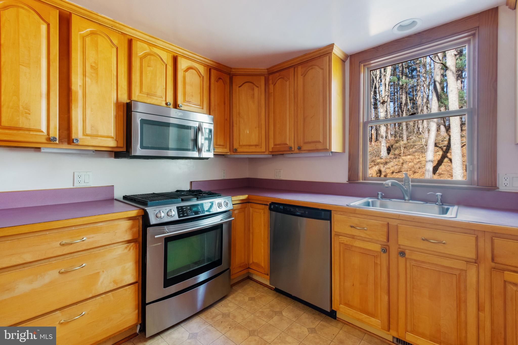 4100 Simpson Drive Westminster, MD 21158 - Photo 14 of 52 a kitchen with cabinets appliances and a sink