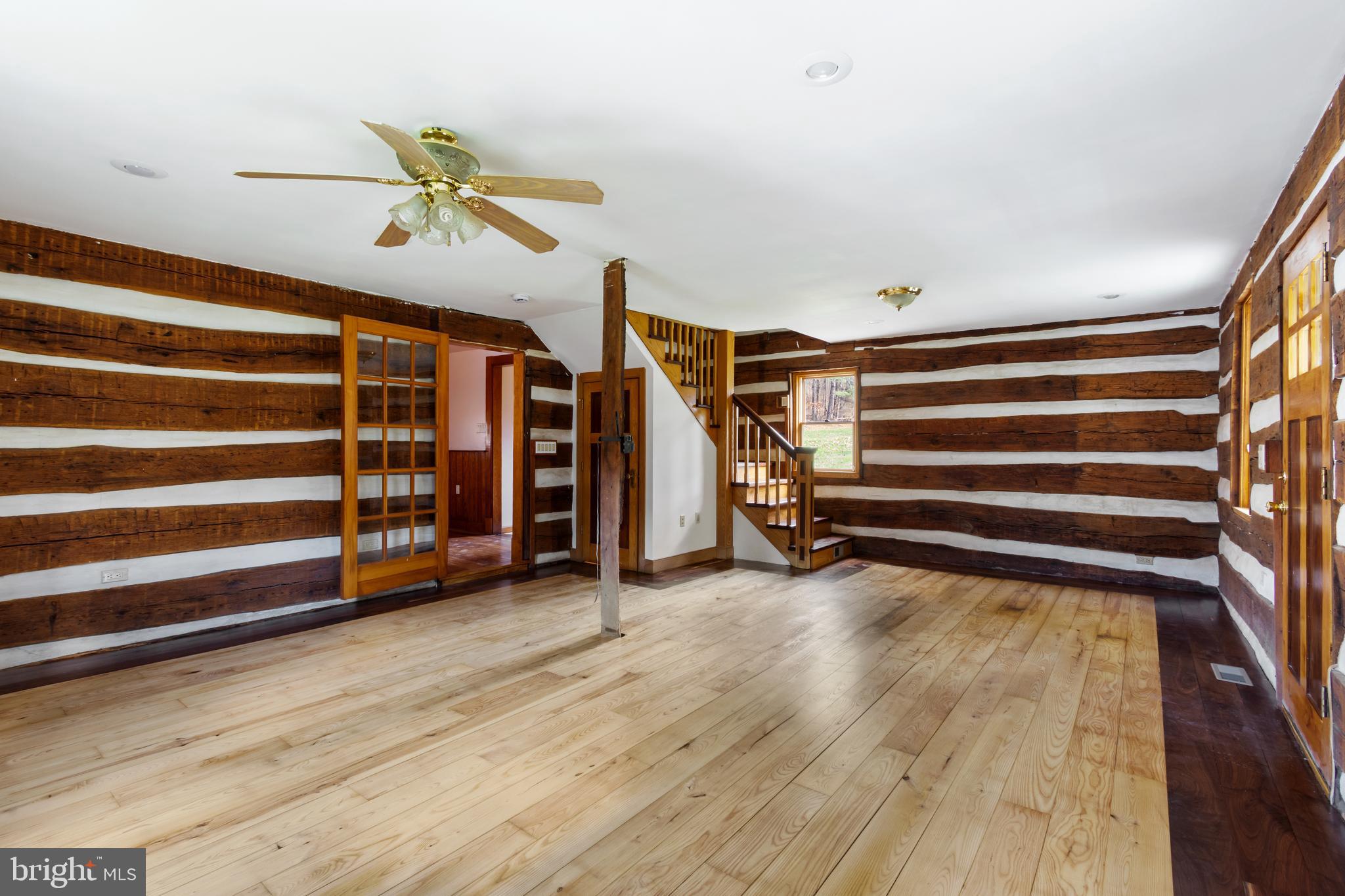 4100 Simpson Drive Westminster, MD 21158 - Photo 19 of 52 a view of room with wooden floor and stairs