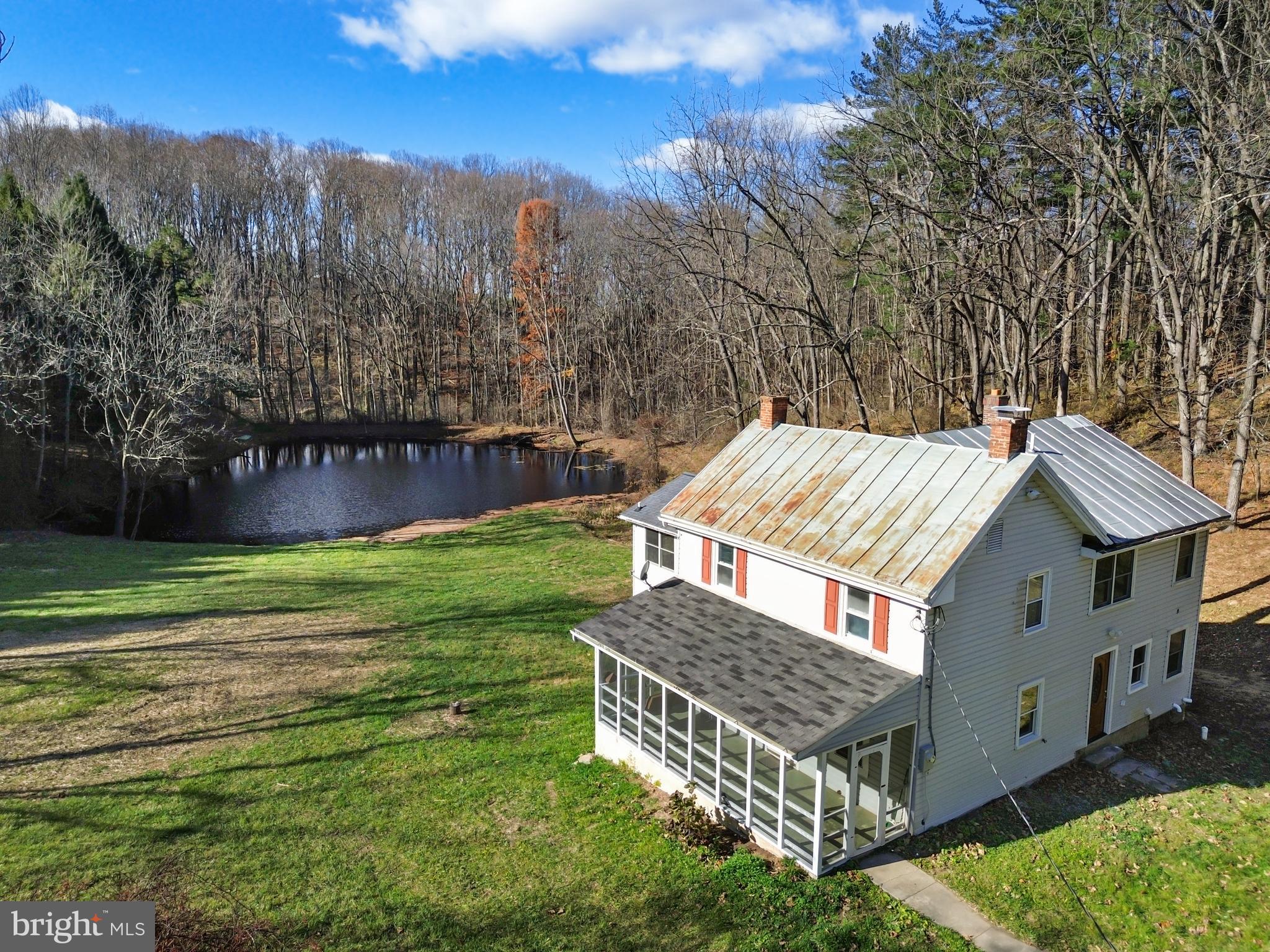 4100 Simpson Drive Westminster, MD 21158 - Photo 2 of 52 a view of a backyard with brick wall and a large tree
