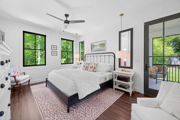 a spacious bedroom with a large bed and a window