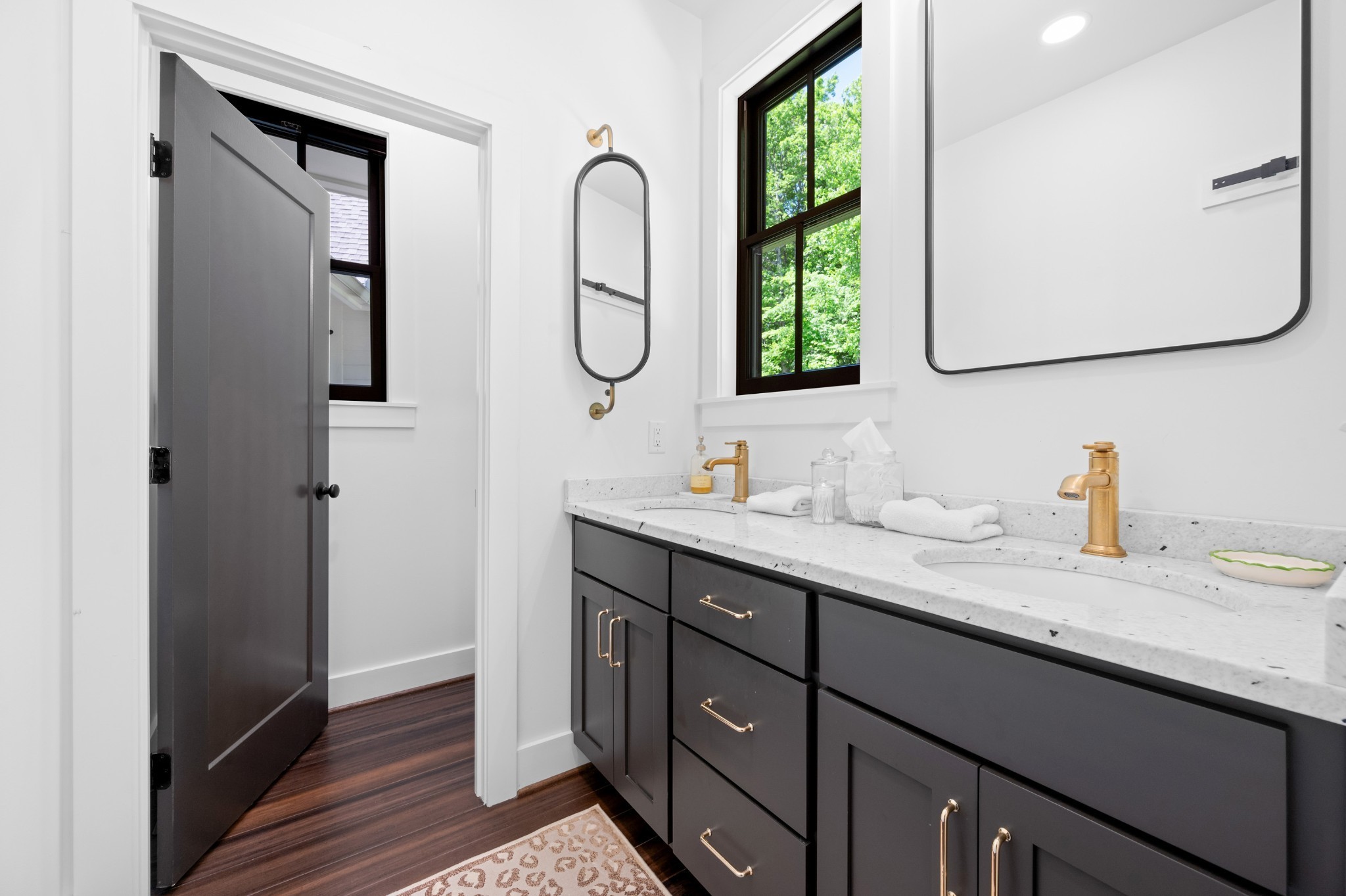 1912 Joppa Road Walling, TN 38587 - Photo 19 of 67 a bathroom with a double vanity sink and a mirror
