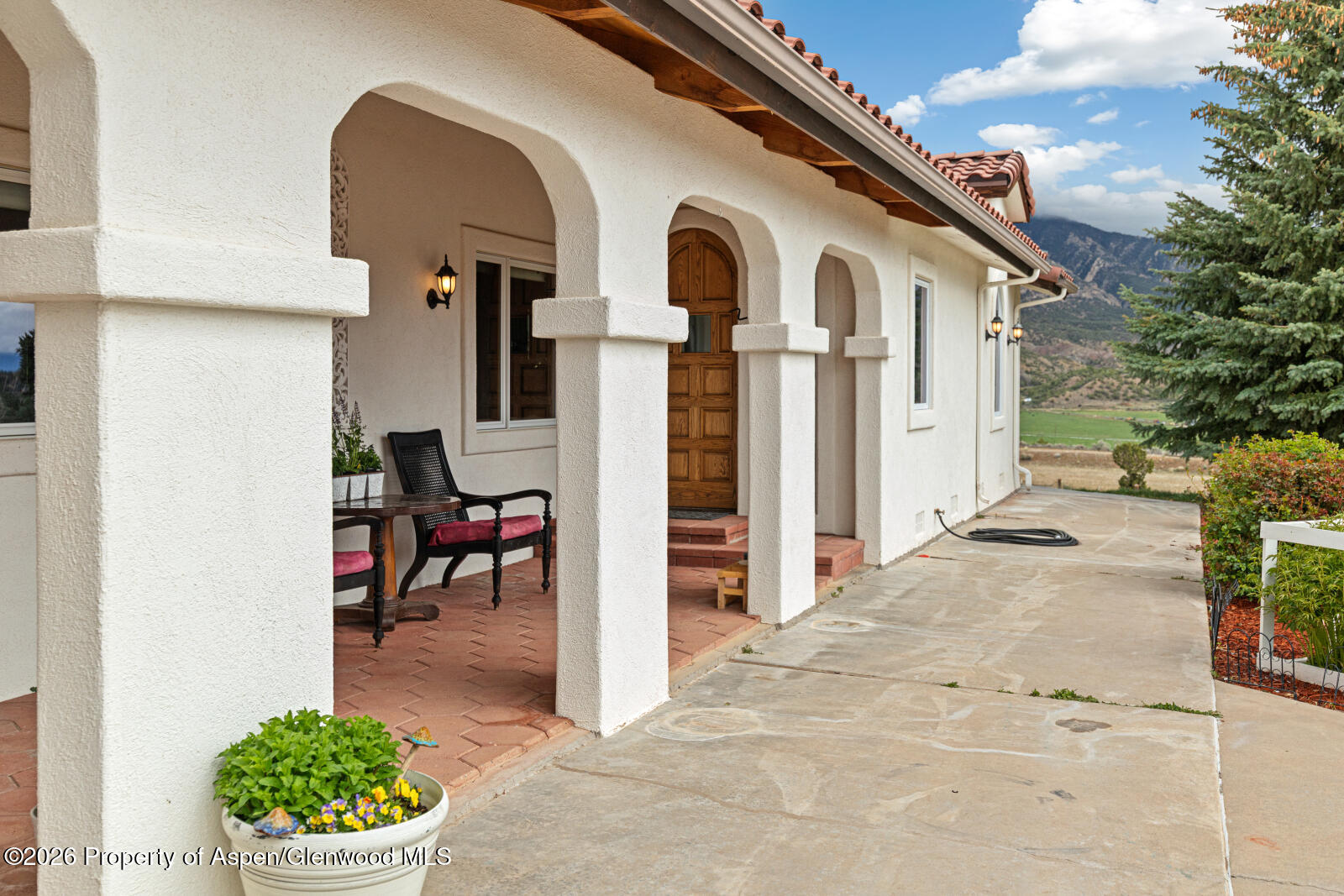 1007 Mesa Drive Rifle, CO 81650 - Photo 10 of 56 a front view of a house with a porch