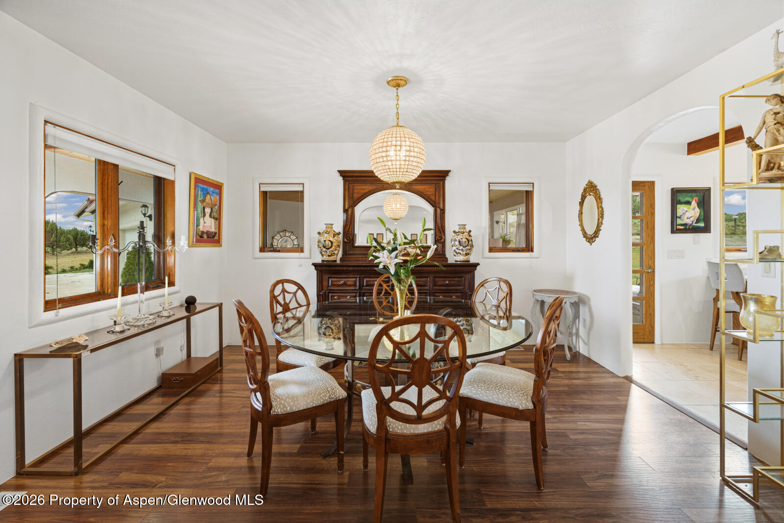 1007 Mesa Drive Rifle, CO 81650 - Photo 16 of 56 a view of a dining room with furniture window and wooden floor