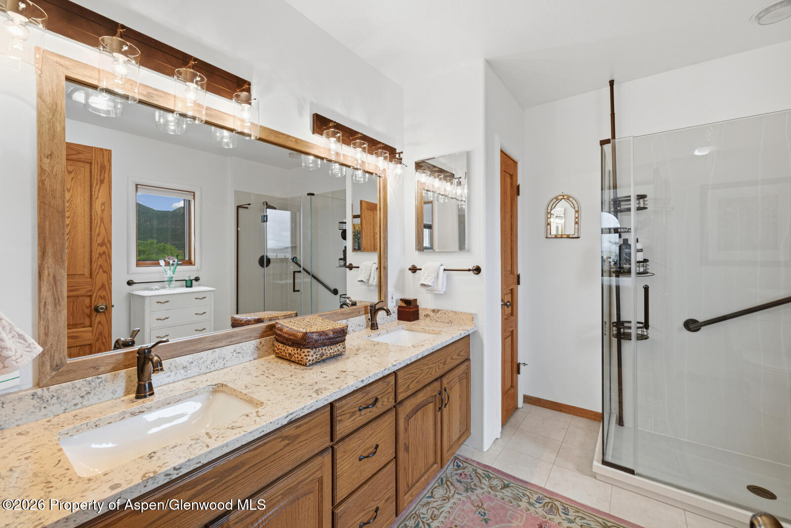 1007 Mesa Drive Rifle, CO 81650 - Photo 31 of 56 a bathroom with a granite countertop sink mirror and double
