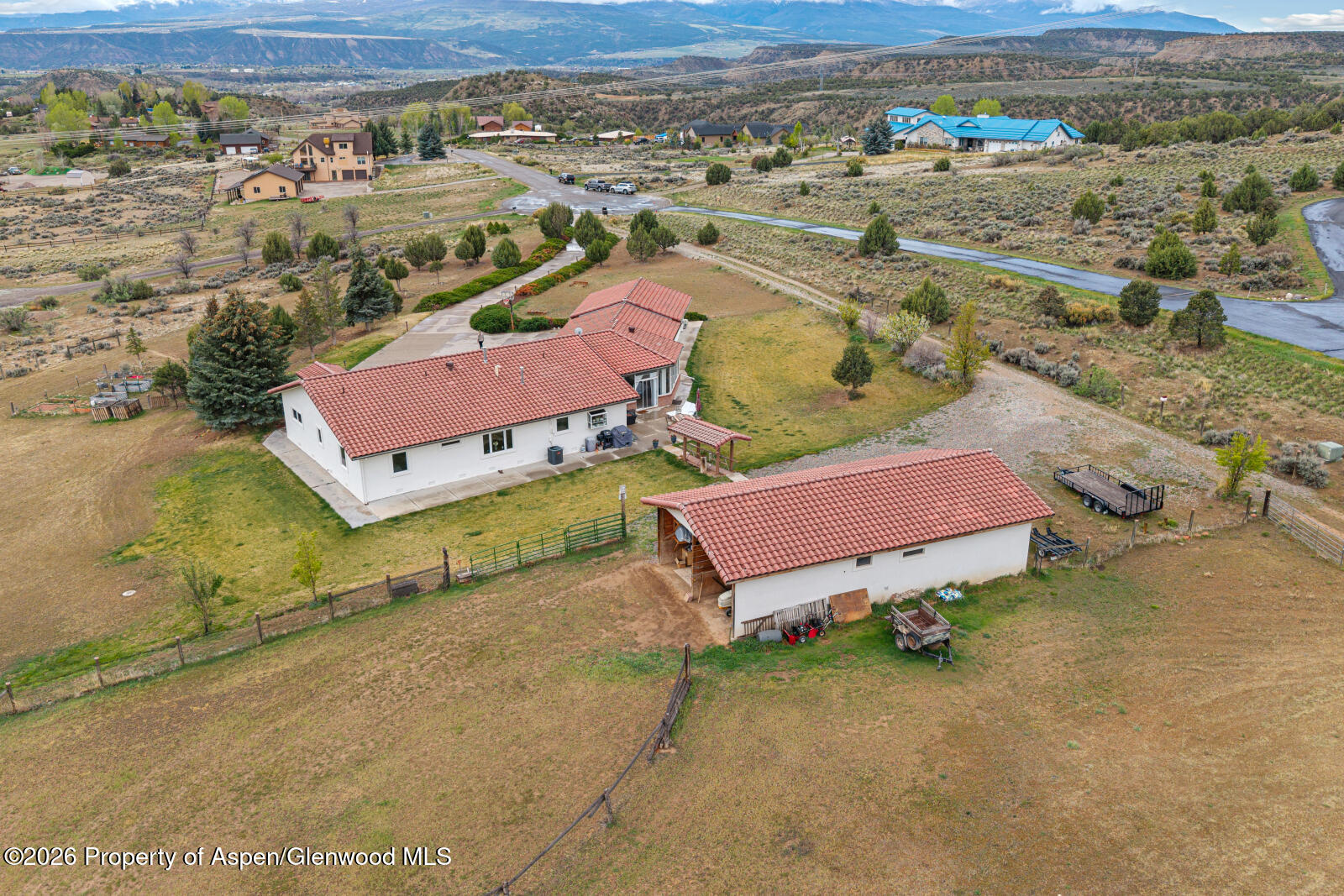 1007 Mesa Drive Rifle, CO 81650 - Photo 4 of 56 an aerial view of a house with a yard