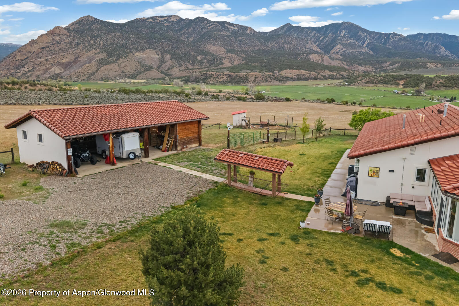 1007 Mesa Drive Rifle, CO 81650 - Photo 43 of 56 a view of a house with a yard and mountain