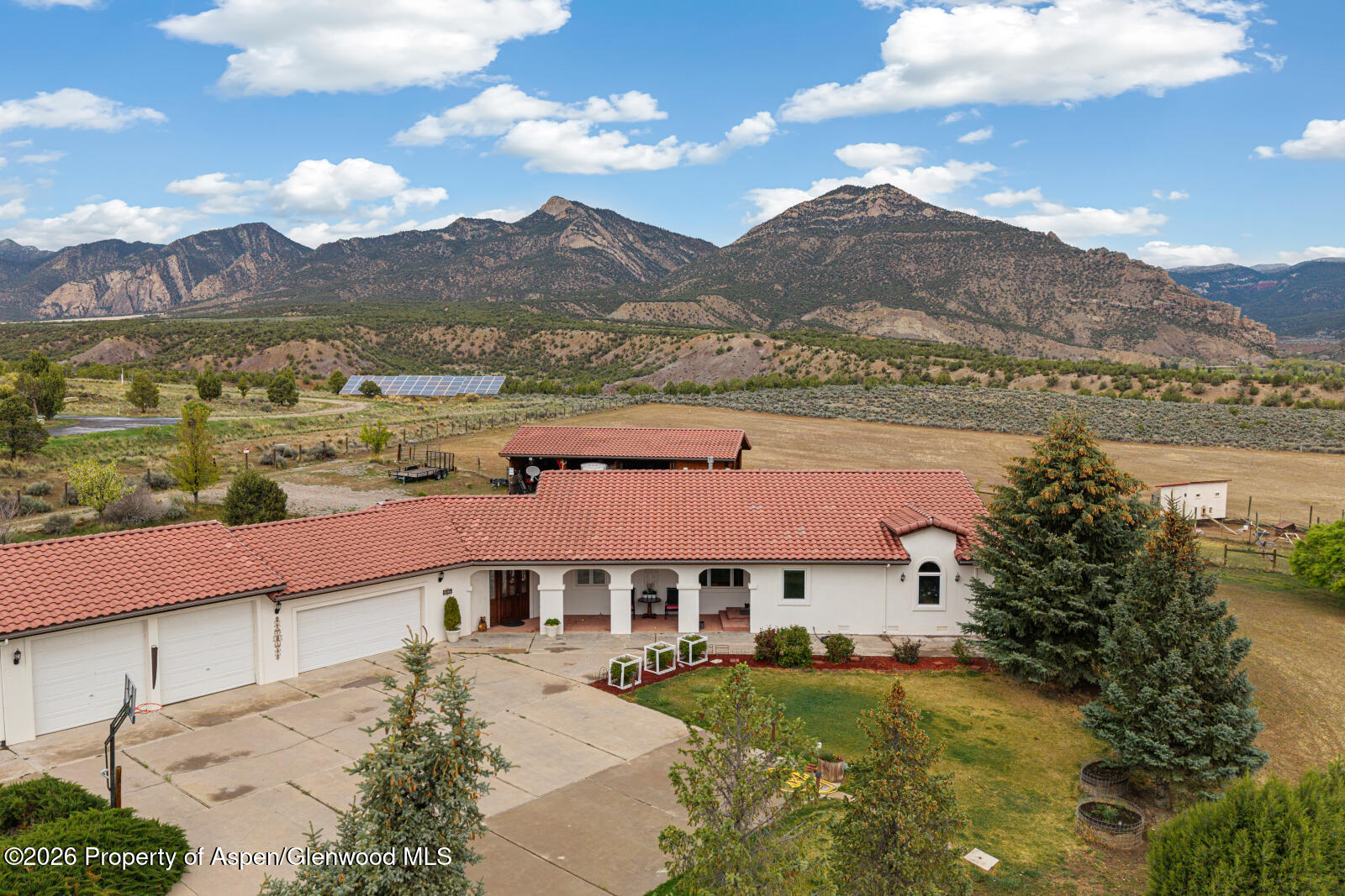 1007 Mesa Drive Rifle, CO 81650 - Photo 48 of 56 a view of a big house with a mountain in the background