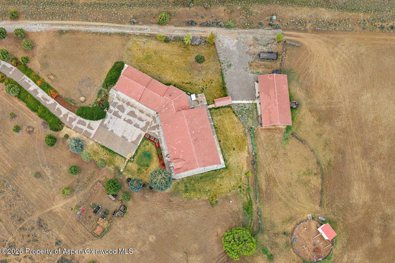 1007 Mesa Drive Rifle, CO 81650 - Photo 7 of 56 an aerial view of residential house with pool and yard