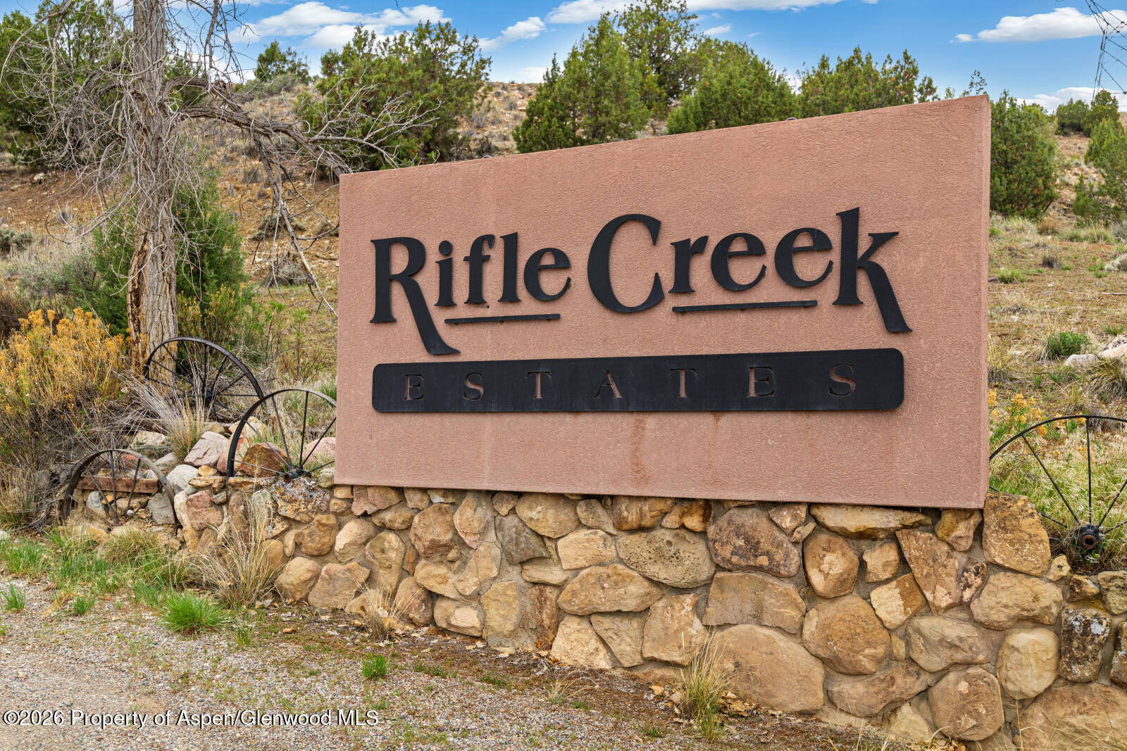 1007 Mesa Drive Rifle, CO 81650 - Photo 8 of 56 a sign broad on the side of the road
