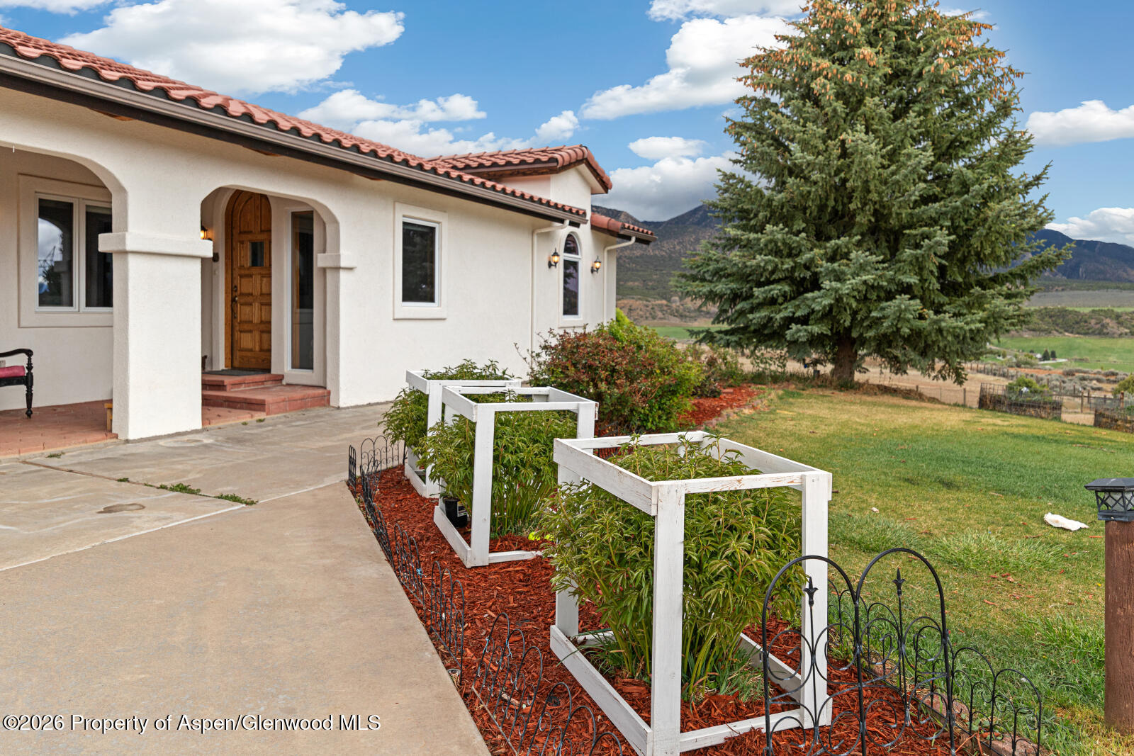 1007 Mesa Drive Rifle, CO 81650 - Photo 9 of 56 a front view of a house with garden