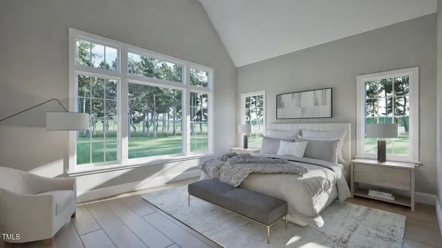 a bed sitting in a bedroom next to a large window