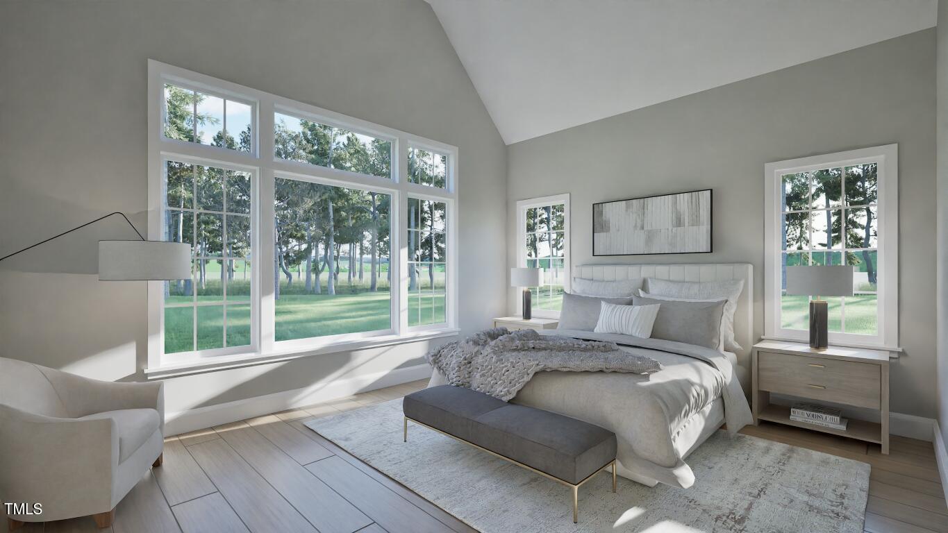 913 Tyrrell Road Raleigh, NC 27609 - Photo 11 of 42 a bed sitting in a bedroom next to a large window