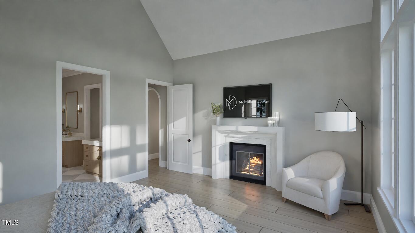 913 Tyrrell Road Raleigh, NC 27609 - Photo 12 of 42 a living room with furniture and a fireplace