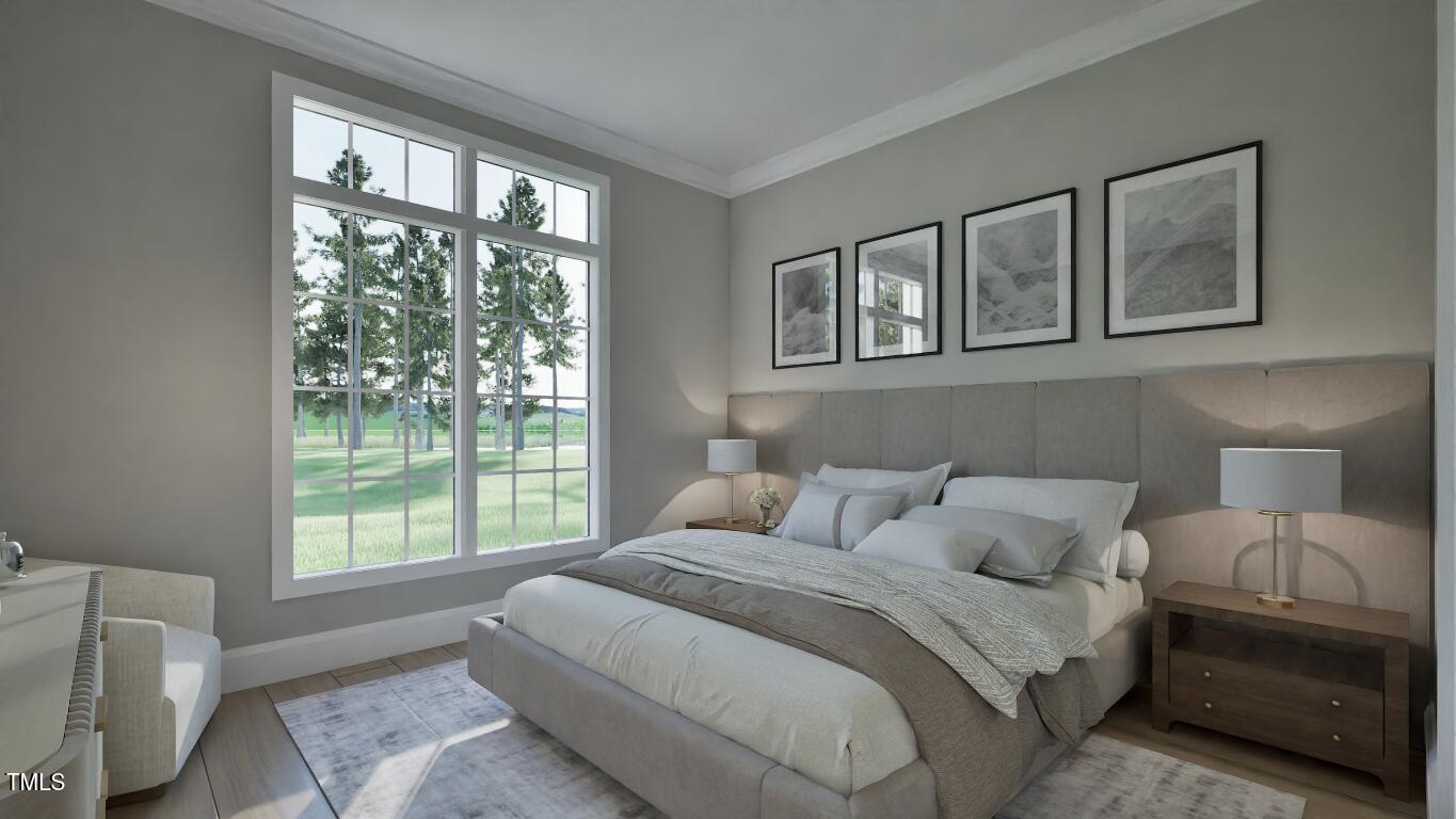 913 Tyrrell Road Raleigh, NC 27609 - Photo 18 of 42 a bedroom with a bed and a window