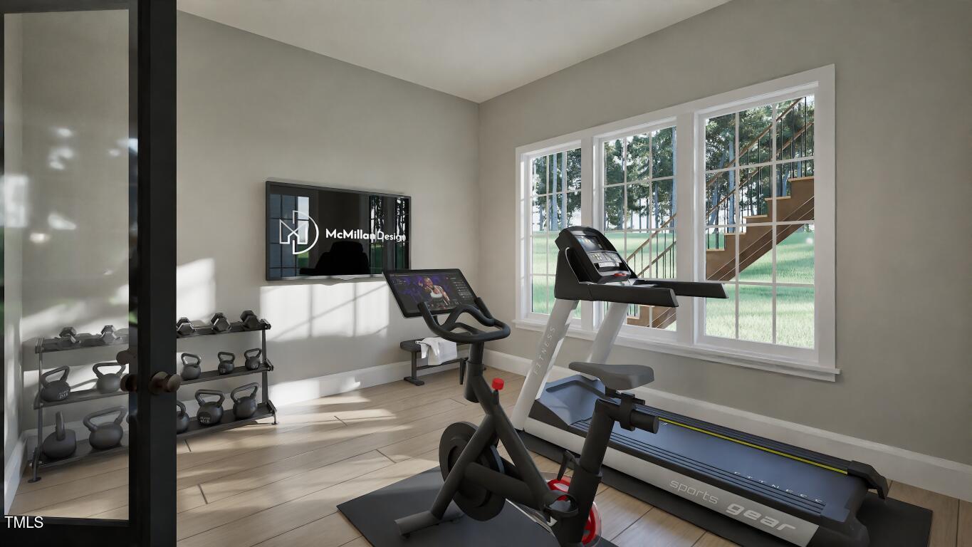 913 Tyrrell Road Raleigh, NC 27609 - Photo 26 of 42 a view of a livingroom with workspace and a window