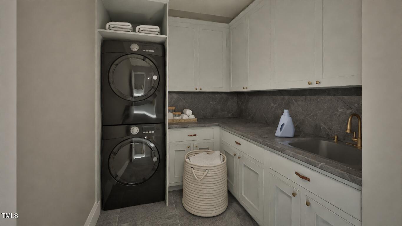 913 Tyrrell Road Raleigh, NC 27609 - Photo 28 of 42 a close view of a utility room with dryer and washer