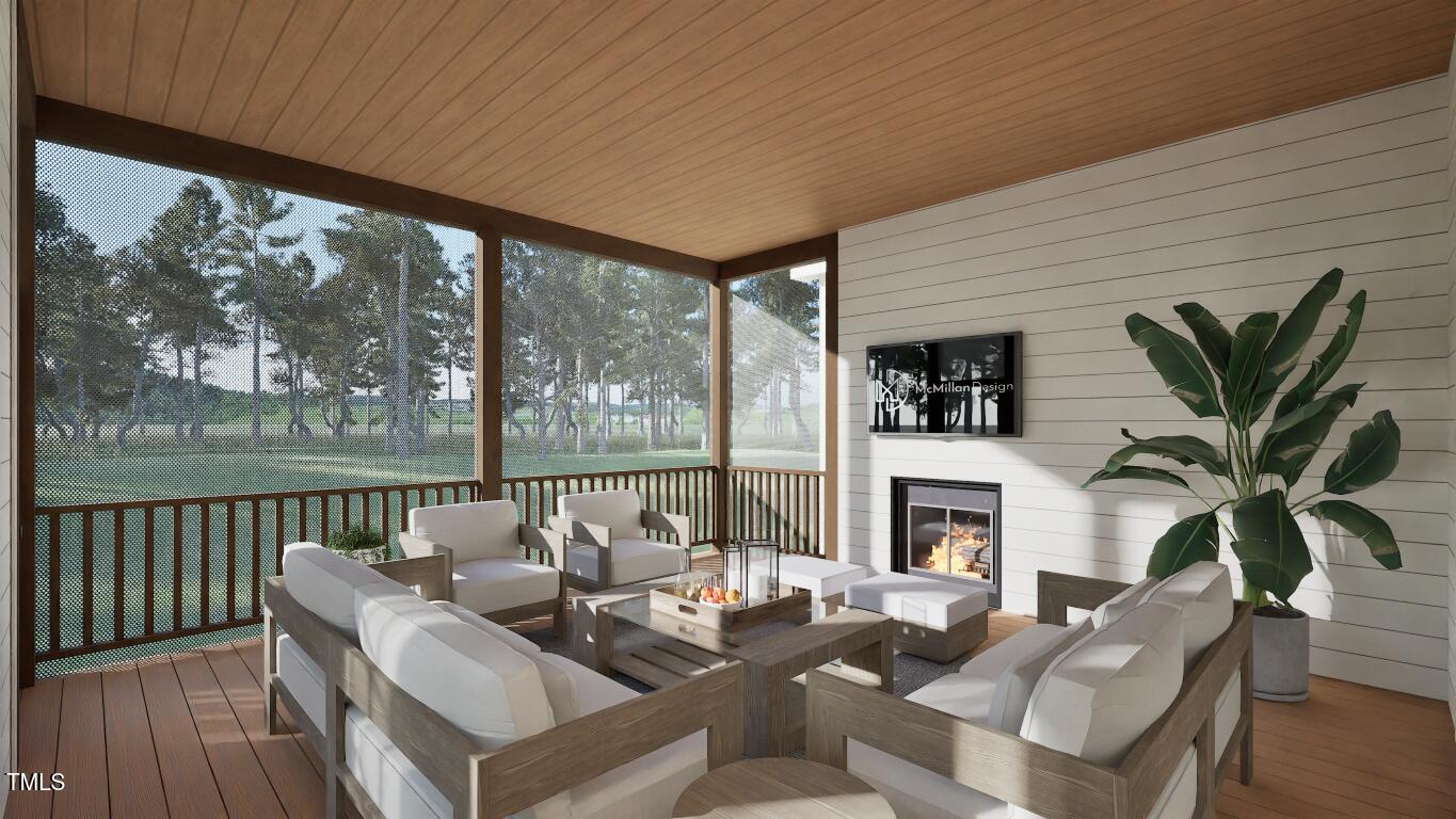 913 Tyrrell Road Raleigh, NC 27609 - Photo 29 of 42 a living room with fireplace furniture and a large window