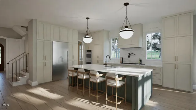 a kitchen with stainless steel appliances a kitchen island a stove a table and chairs