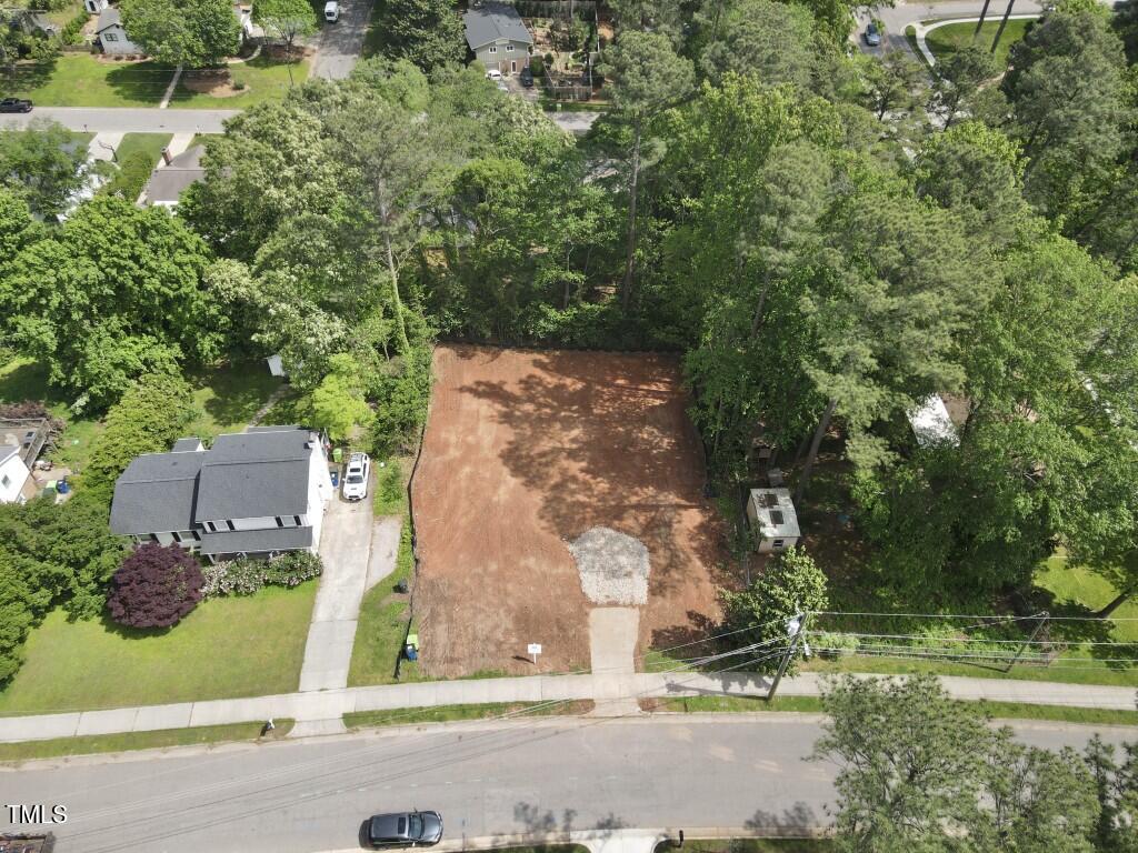 913 Tyrrell Road Raleigh, NC 27609 - Photo 37 of 42 an aerial view of a house with a yard and a large tree