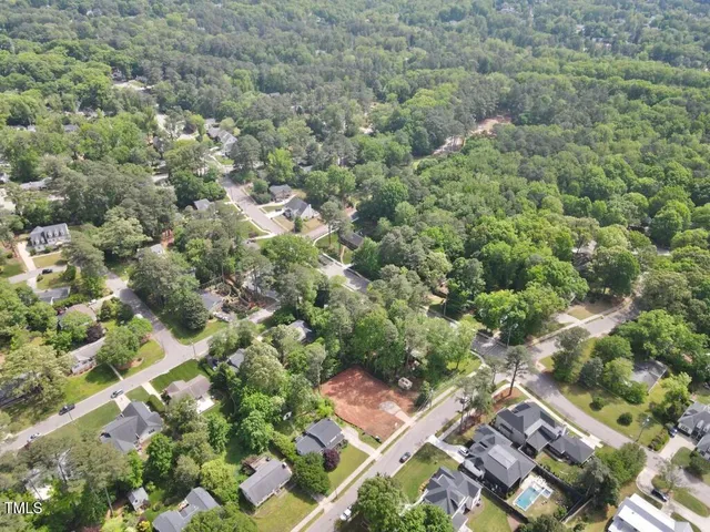 an aerial view of a residential houses with outdoor space