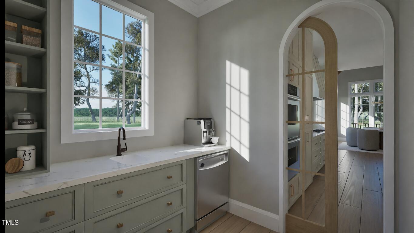 913 Tyrrell Road Raleigh, NC 27609 - Photo 5 of 42 a kitchen with sink and window