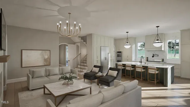 a living room with lots of furniture kitchen view and a chandelier