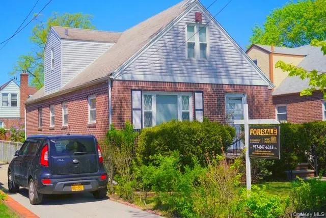 a car parked in front of a house
