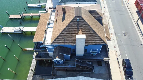 an aerial view of houses with outdoor space