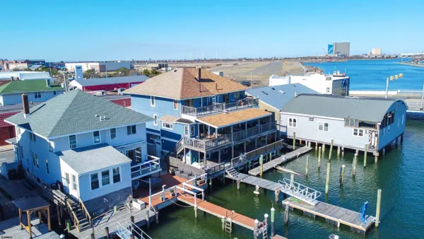 an aerial view of a house with a ocean view