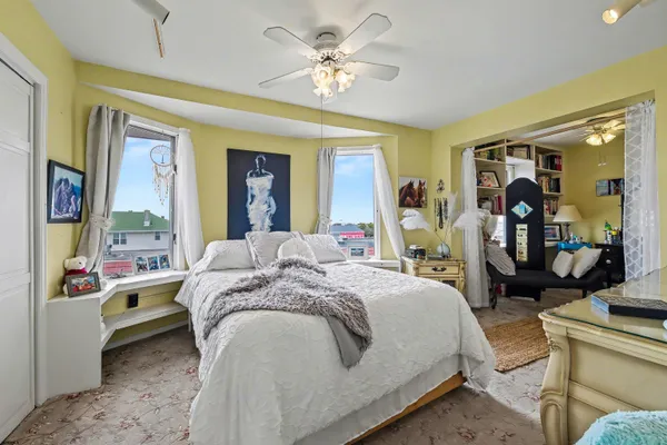 a bed room with a bed and a large mirror