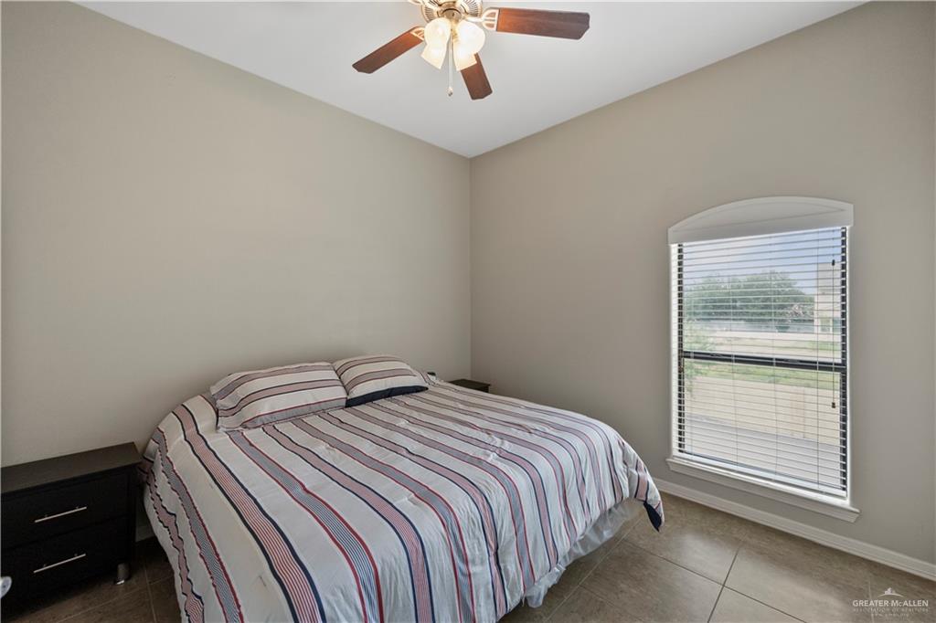 2715 Mimosa Street, Unit 9 Mission, TX 78574 - Photo 18 of 21 a bedroom with a bed and a window