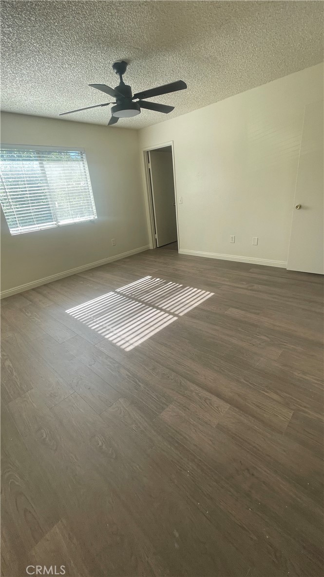 2560 Gonzaga Lane Riverside, CA 92507 - Photo 20 of 52 an empty room with a ceiling fan and window