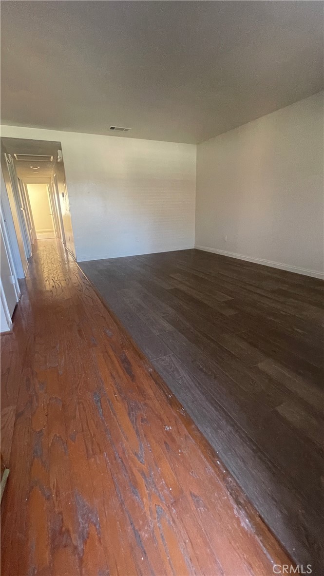 2560 Gonzaga Lane Riverside, CA 92507 - Photo 33 of 52 a view of an empty room and wooden floor