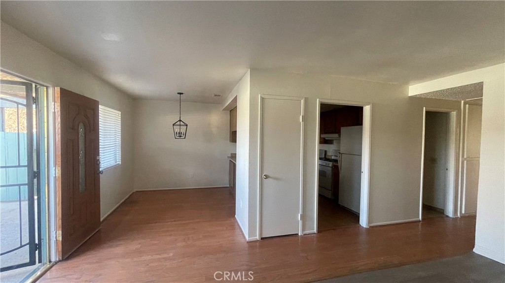 2560 Gonzaga Lane Riverside, CA 92507 - Photo 6 of 52 an empty room with closet and wooden floor