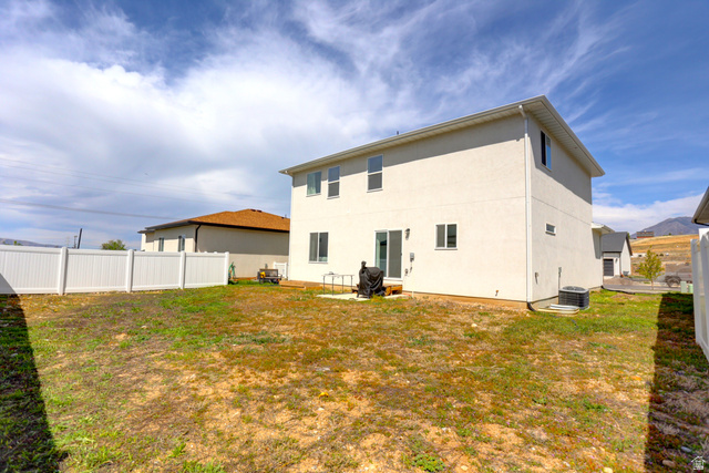 815 West Powderwood Lane Mapleton, UT 84664 - Photo 31 of 39 Rear view of house featuring stucco siding and a patio area