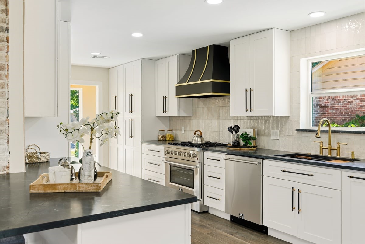 12510 Deep Spring Lane Houston, TX 77077 - Photo 2 of 37 Feel inspired in this large, extended kitchen! Expansive black leather granite provide great prep space! The chef of the home will delight in using the Forno appliances!