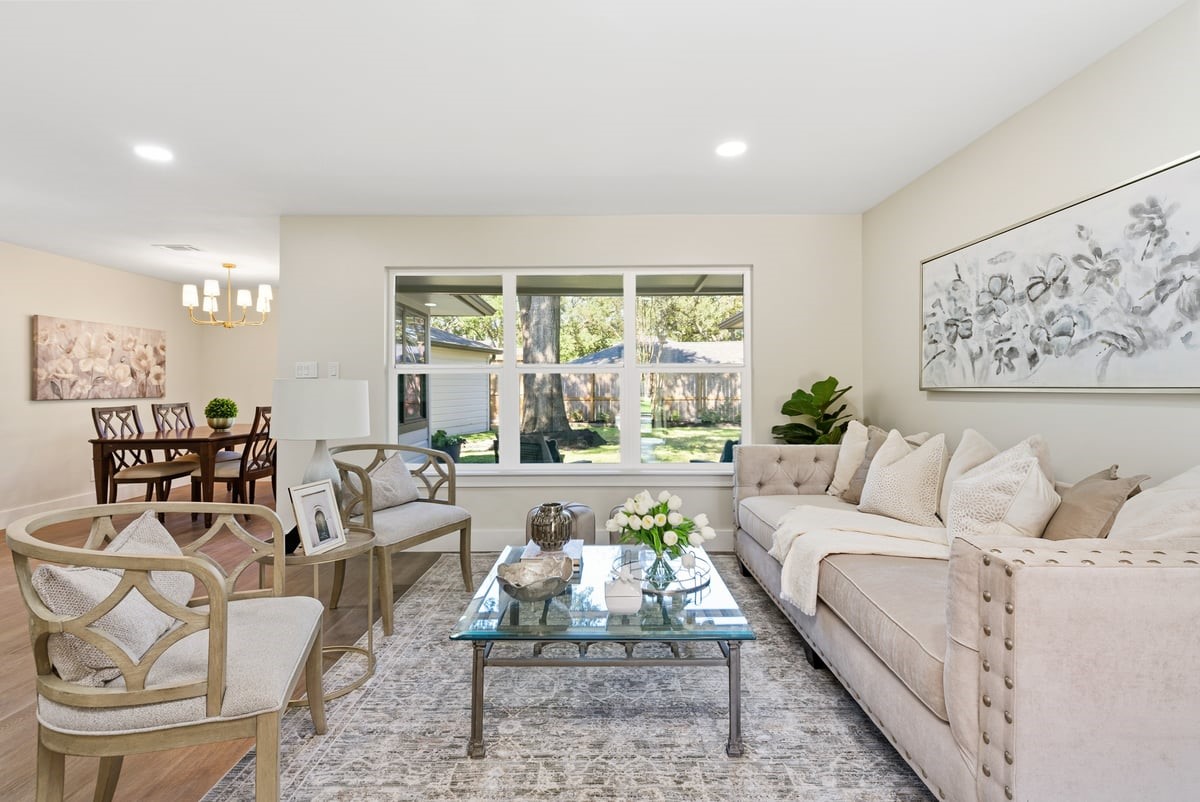 12510 Deep Spring Lane Houston, TX 77077 - Photo 3 of 37 Imagine the memories you will make with loved ones gathered in the living room! Natural light flows in through bright windows as you enjoy picturesque views of the landscaped back yard!