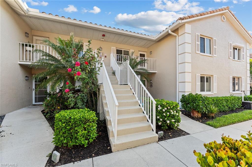 5928 Cranbrook Way, Unit D202 Naples, FL 34112 - Photo 2 of 23 Beautiful landscaping abounds private entry