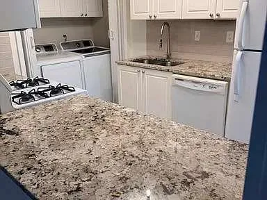 a kitchen with a stove and a refrigerator