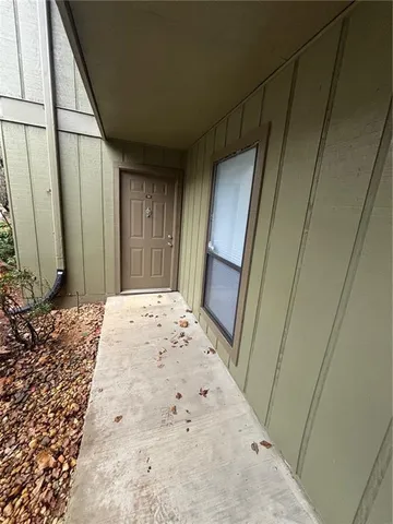 a bedroom with a bed and a mirror