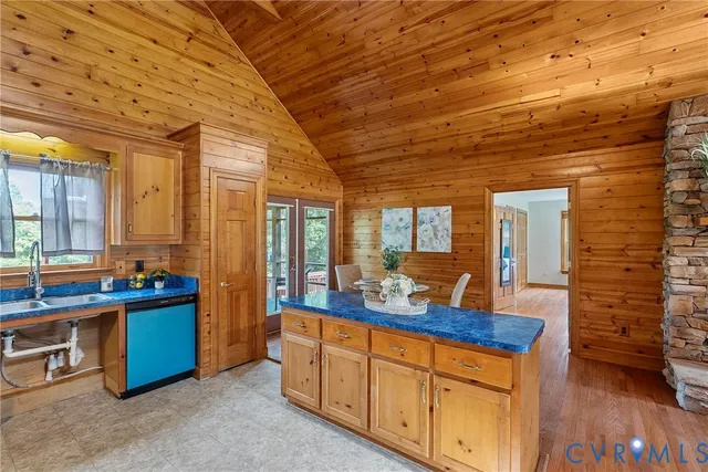 a spacious bedroom with a bed and a fireplace