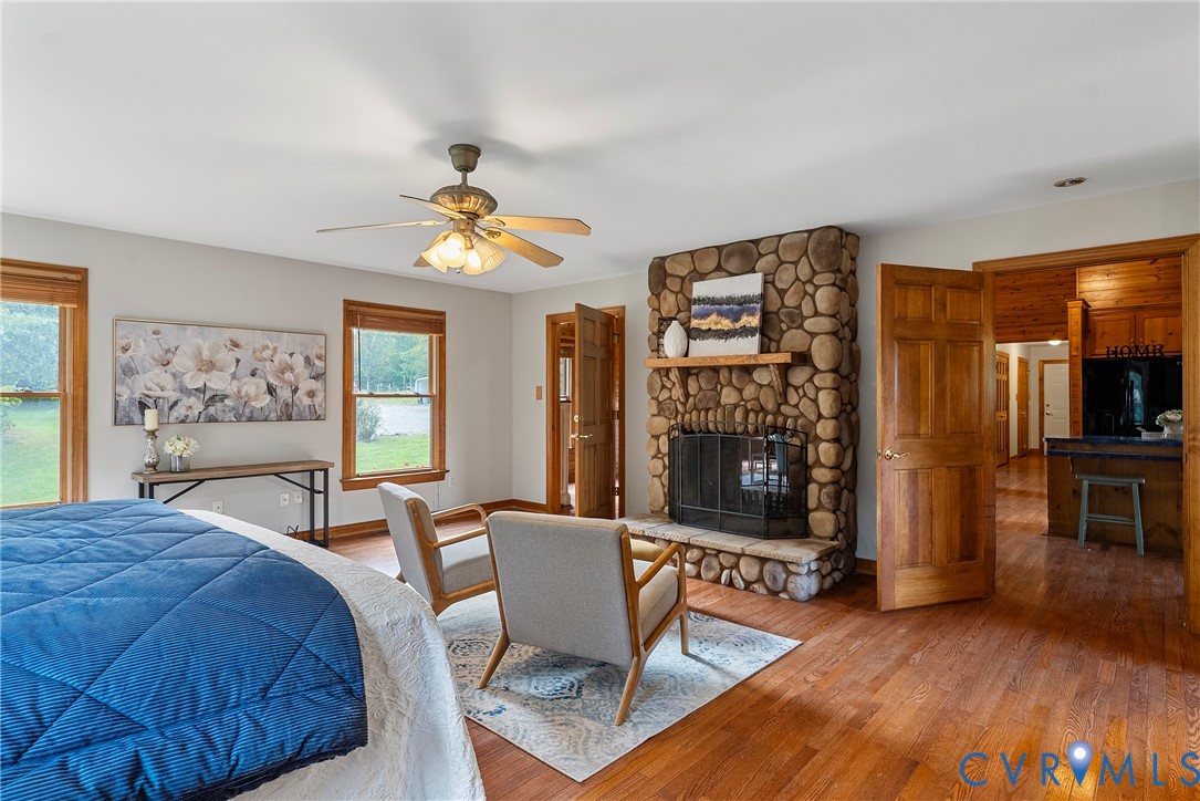 949 Old Buckingham Road Cumberland, VA 23040 - Photo 21 of 49 a living room with furniture a fireplace and a table