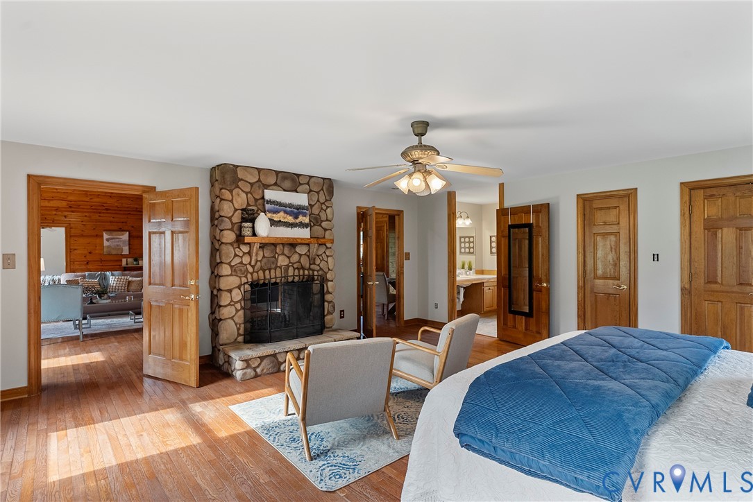 949 Old Buckingham Road Cumberland, VA 23040 - Photo 22 of 49 a spacious bedroom with a bed and a fireplace
