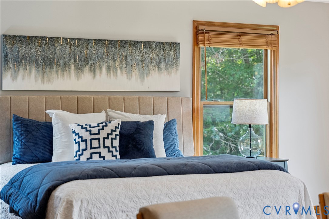 949 Old Buckingham Road Cumberland, VA 23040 - Photo 25 of 49 a bed sitting in a bedroom next to a window