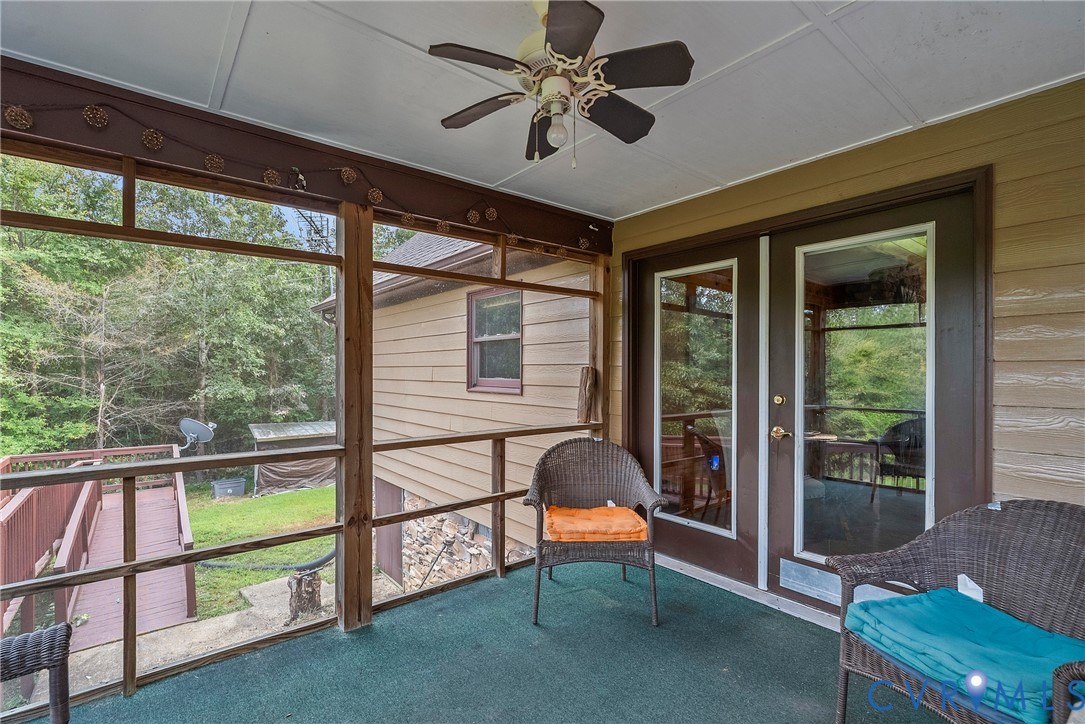 949 Old Buckingham Road Cumberland, VA 23040 - Photo 31 of 49 a view of a porch with furniture and a gate