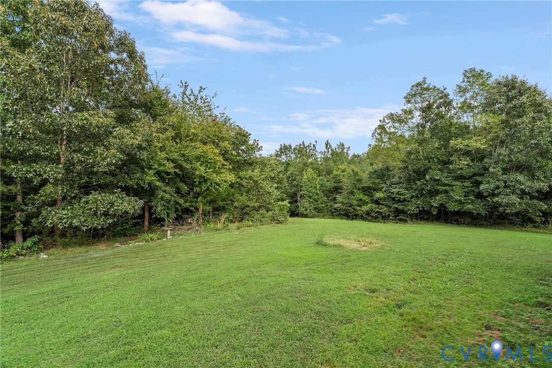 949 Old Buckingham Road Cumberland, VA 23040 - Photo 37 of 49 a view of a field with a trees in the background
