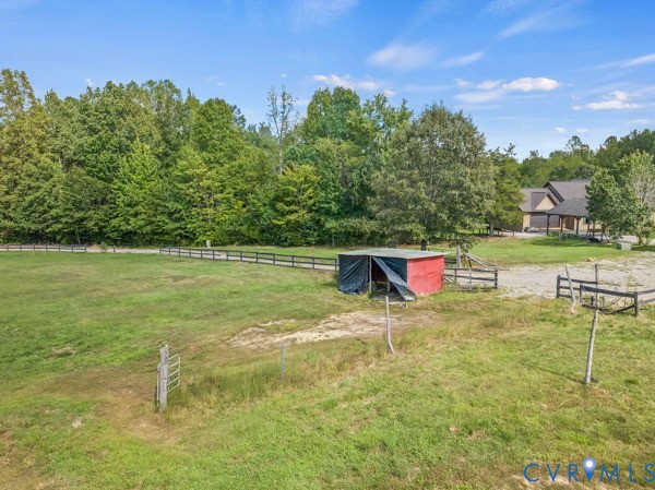 949 Old Buckingham Road Cumberland, VA 23040 - Photo 4 of 49 a backyard of a house with table and chairs