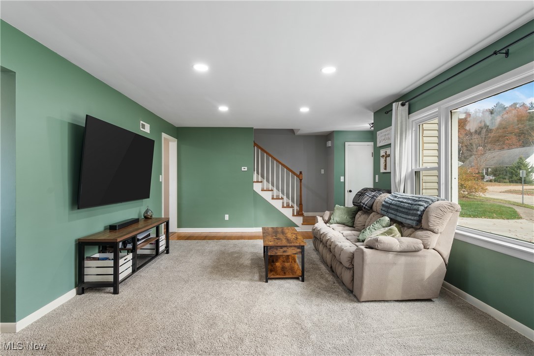 1436 Rumbaugh Circle Wooster, OH 44691 - Photo 6 of 30 Living room featuring plenty of natural light and carpet